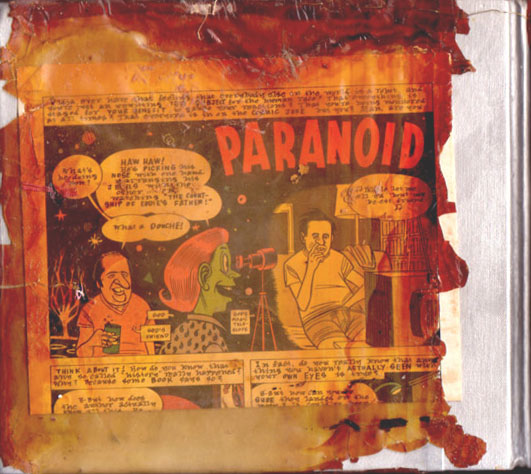 Back cover of sketchbook 16A: a Daniel Clowes 'PARANOID' comic page varnished in amber, its edges dissolving into dark red drips