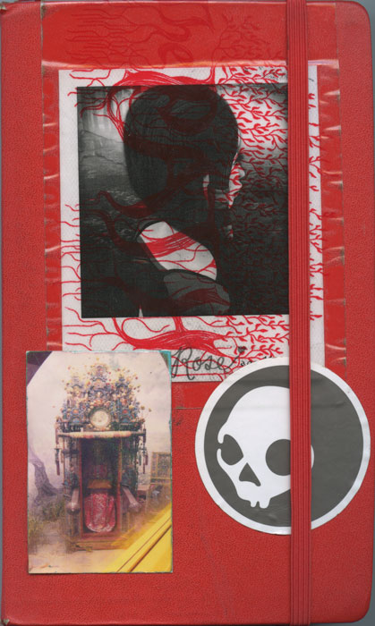 Cover of sketchbook 36: red Moleskine with a dark Polaroid of a braided head wrapped in red-veined tissue, a postcard of an ornate clock-tower shrine, and a skull sticker